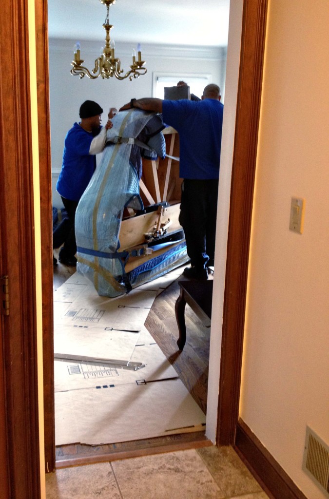 Moving the piano in.