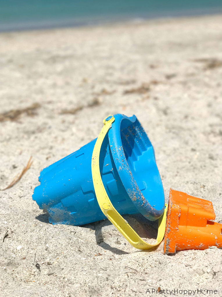 sand pail on the beach living in the moment