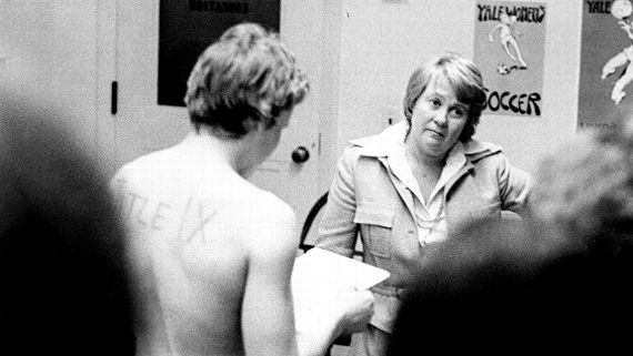 March 3, 1976: Joni Barnett, Yale's Director of Physical Education, listens as Chris Ernst reads the team's grievance. Nina Haight/Yale Daily News