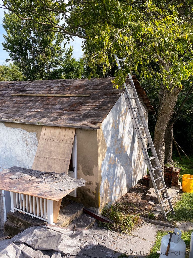 black metal roof carriage house before slate removal