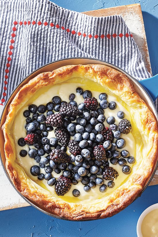 dutch baby with custard via style at home on the happy list