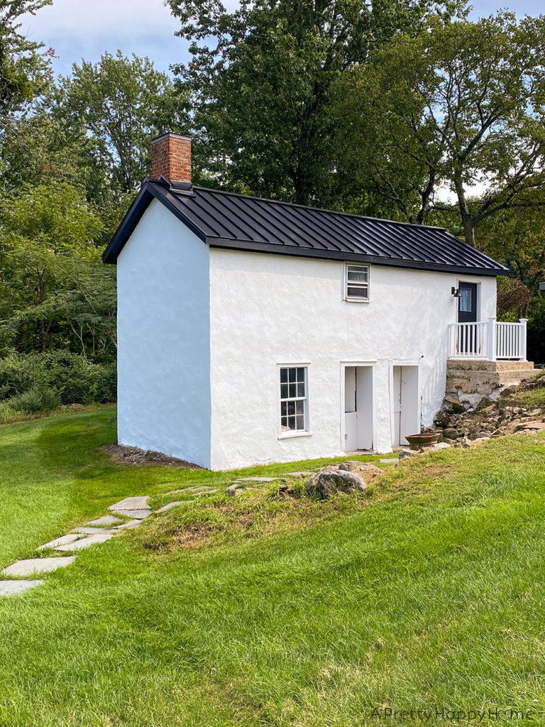 carriage house white with black metal roof