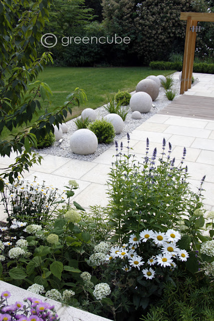 garden with sculptural balls by greencube on the happy list