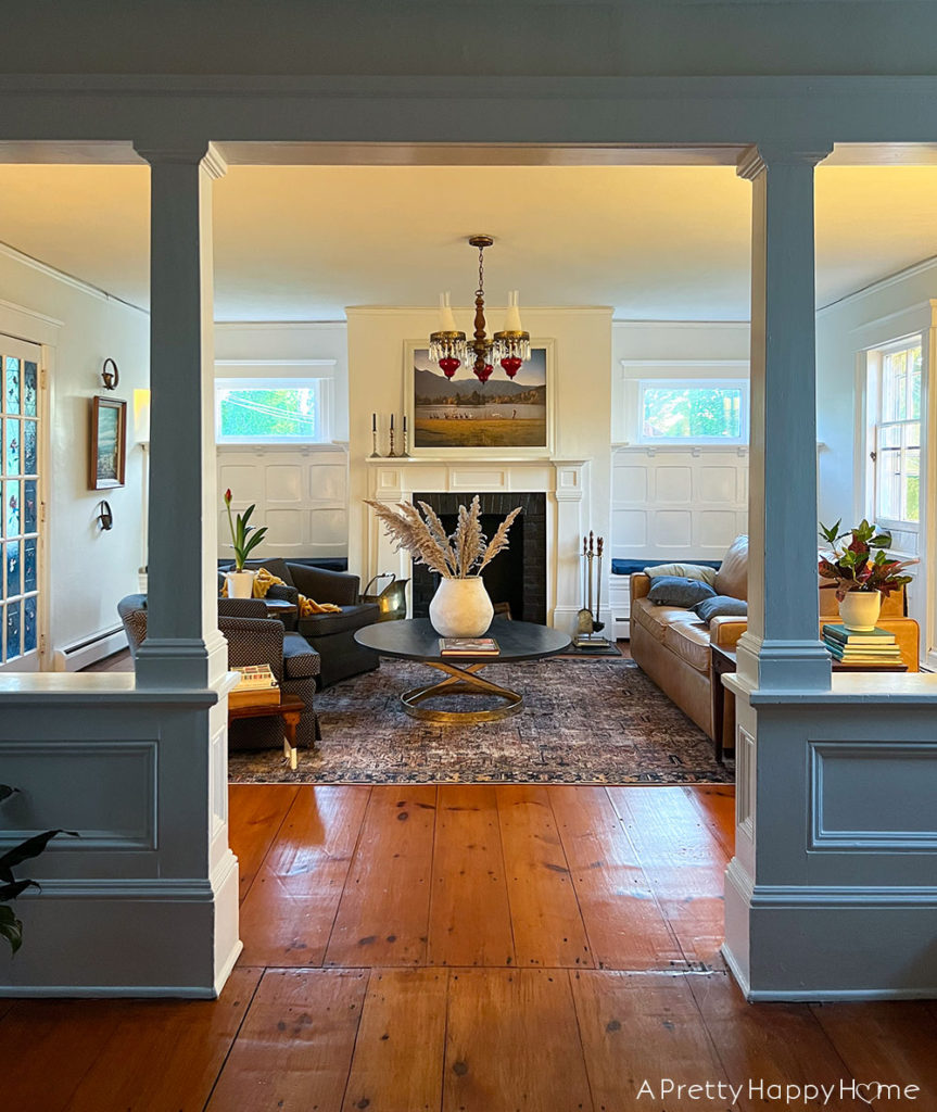 Candid Photos of Our House That Give Me Warm Fuzzy Feelings colonial farmhouse living room bathed in warm light from setting sun