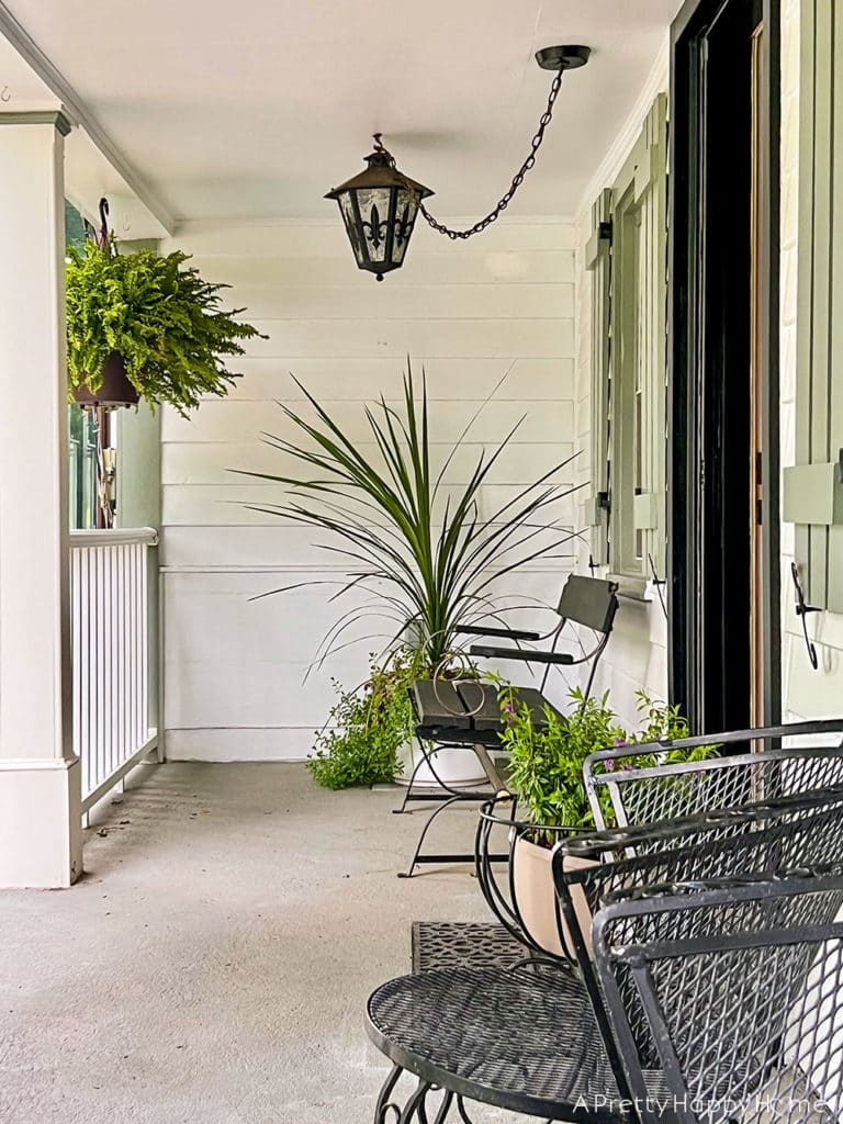 Candid Photos of Our House That Give Me Warm Fuzzy Feelings colonial farmhouse front porch with black light and bench