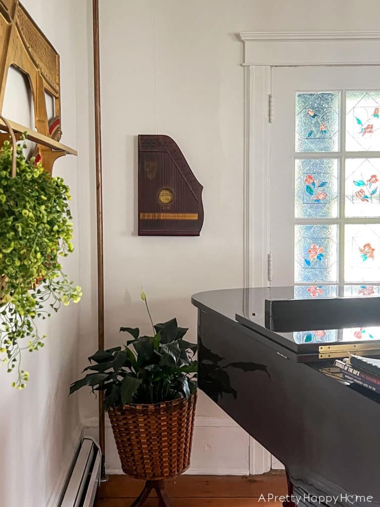 Candid Photos of Our House That Give Me Warm Fuzzy Feelings zither guitar on music room wall