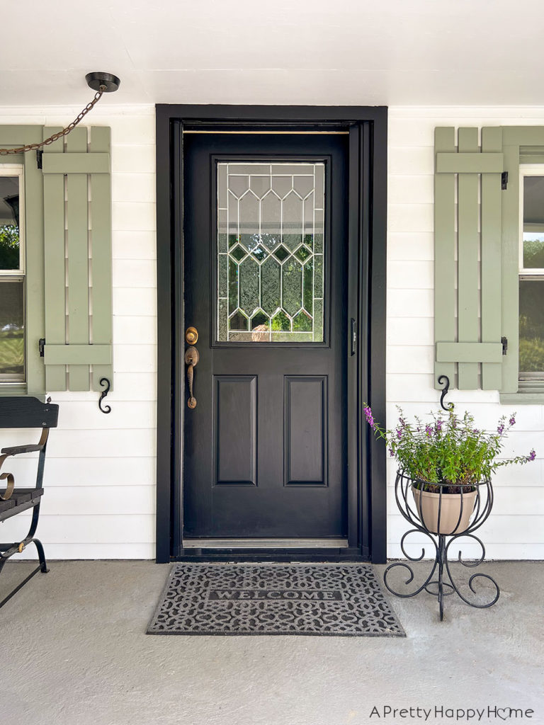How We Made Our Front Door Look Bigger With Paint AFTER door, trim, and screen door painted all the same color