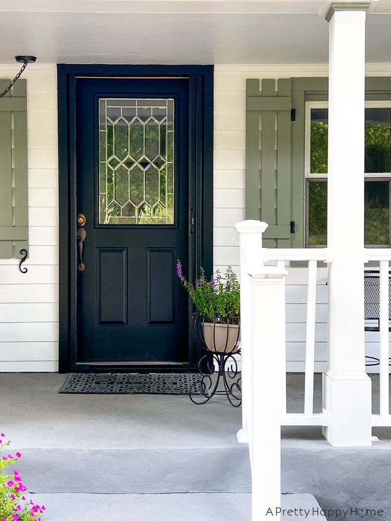 How We Made Our Front Door Look Bigger With Paint AFTER door, trim, and screen door painted all the same color