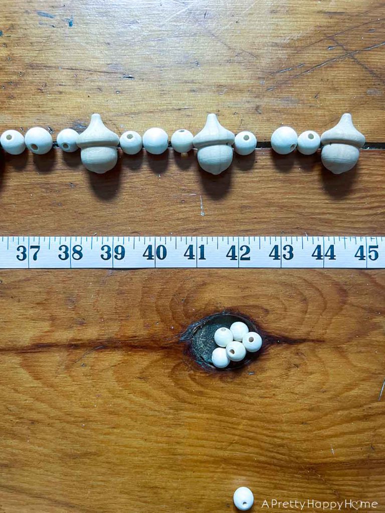 DIY Wood Acorn and Bead Garland how to make a fall garland with wood acorns and wood beads