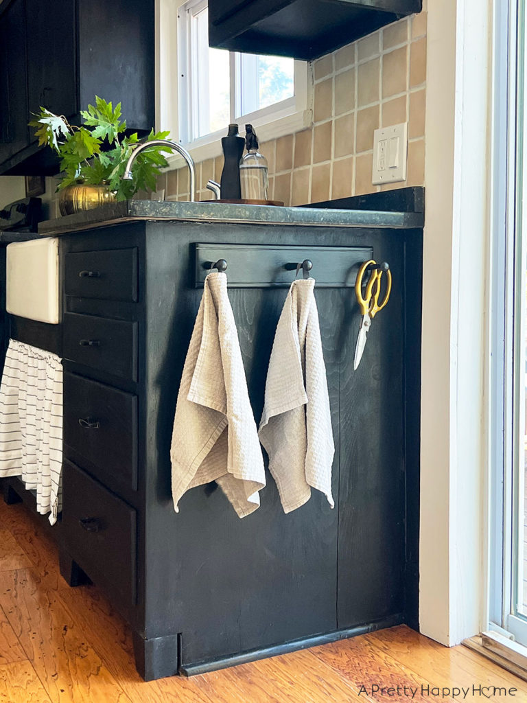 no utility closet space then make a utility wall to hang broom, mop, scissors and vacuum