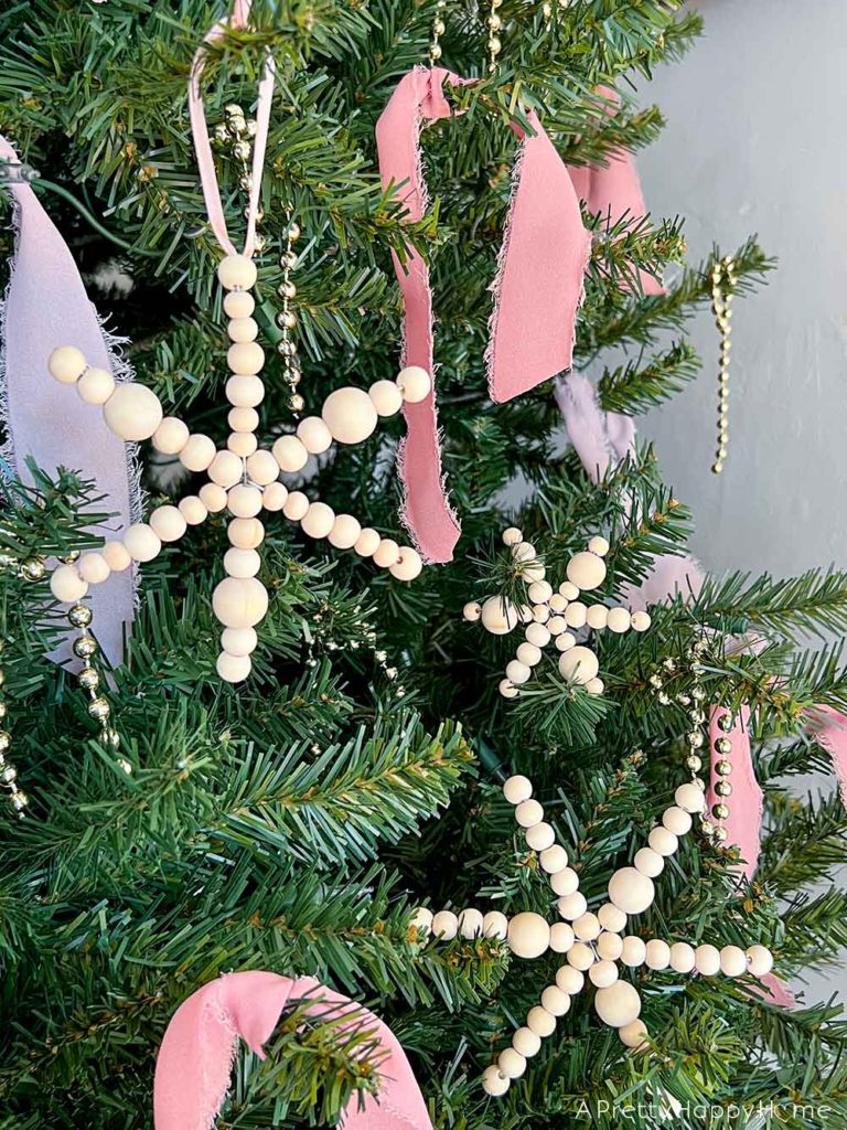 diy wood bead snowflake ornaments using a wire form and natural wood beads