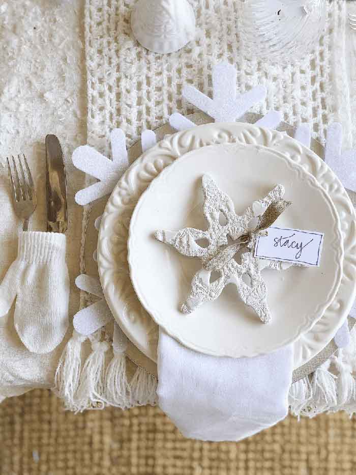 winter tablescape place setting from Vintage Home with air clay snowflake place cards on the happy list