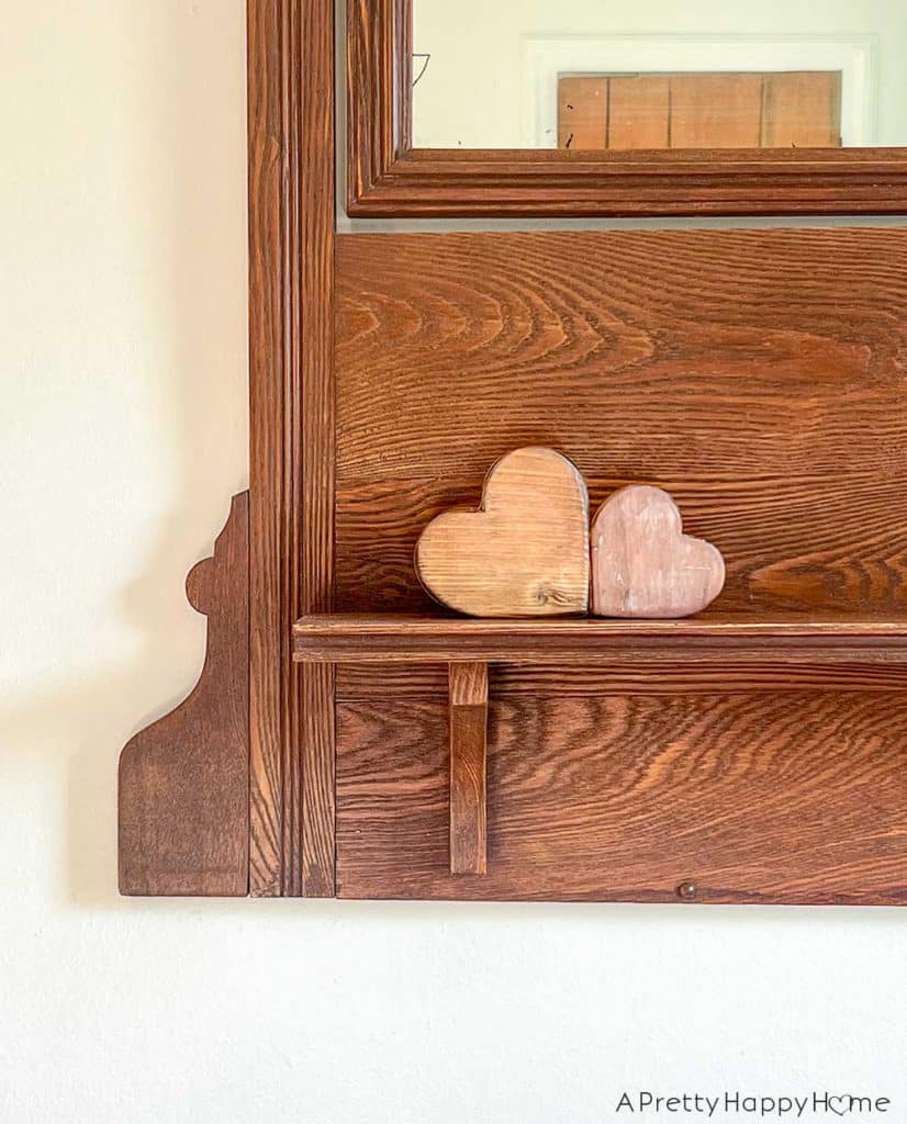 Recent Home Photos That Made Me Smile two wood hearts sitting on a wood ledge
