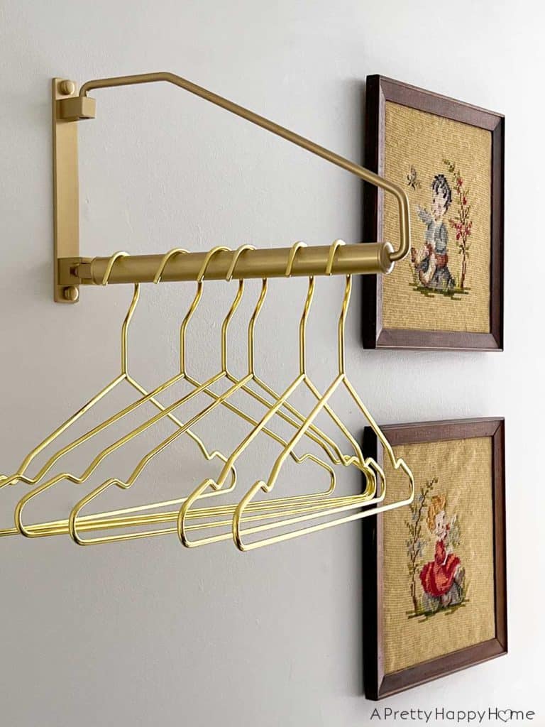 modern country laundry room in a colonial farmhouse with wainscoting stained glass horse art basket wall and inset wall shelves