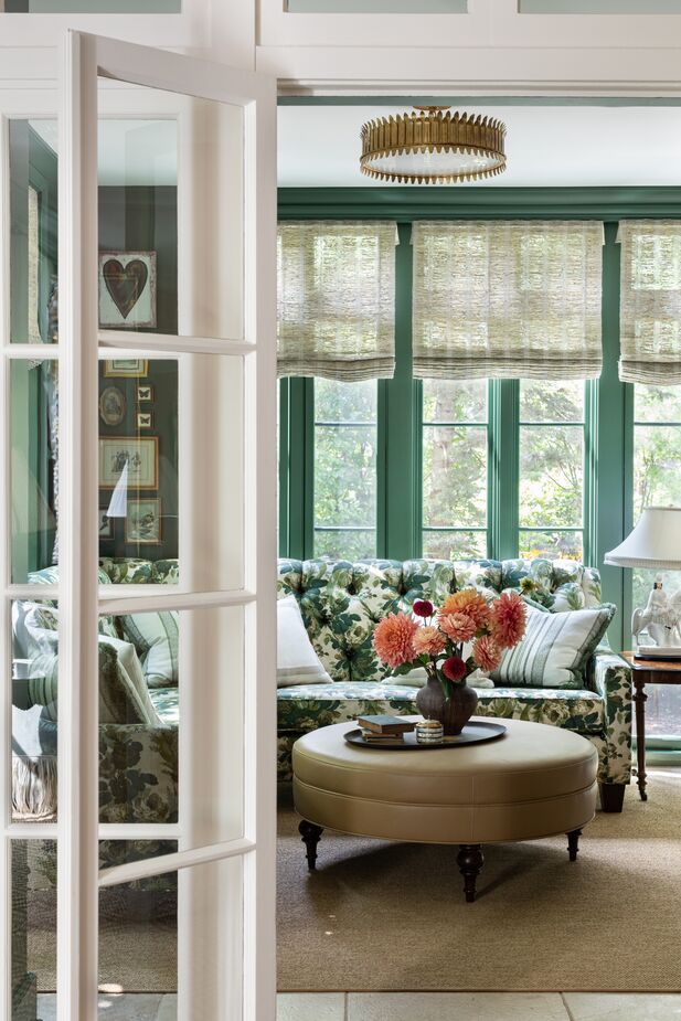 sunroom with green millwork via designer Alexandra Kaehler via the One Kings Lane blog on the happy list