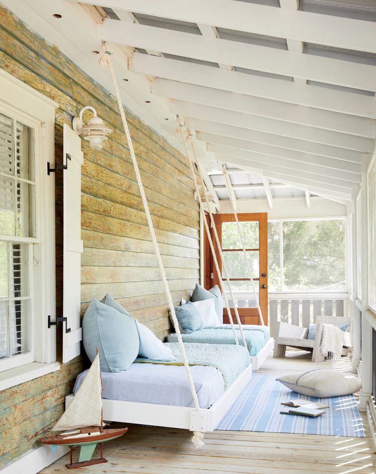 blue and white sleeping porch with beds secured to the wall PHOTO: BRIE WILLIAMS; STYLING: LIZ STRONG via sunset magazine on the happy list