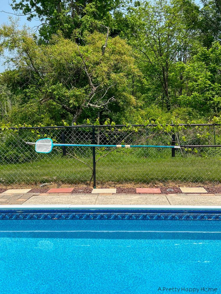DIY Pool Maintenance Tool Holder For Leaf Skimmers and Poles DIY wood rack for holding leaf skimmers and telescoping poles around a pool