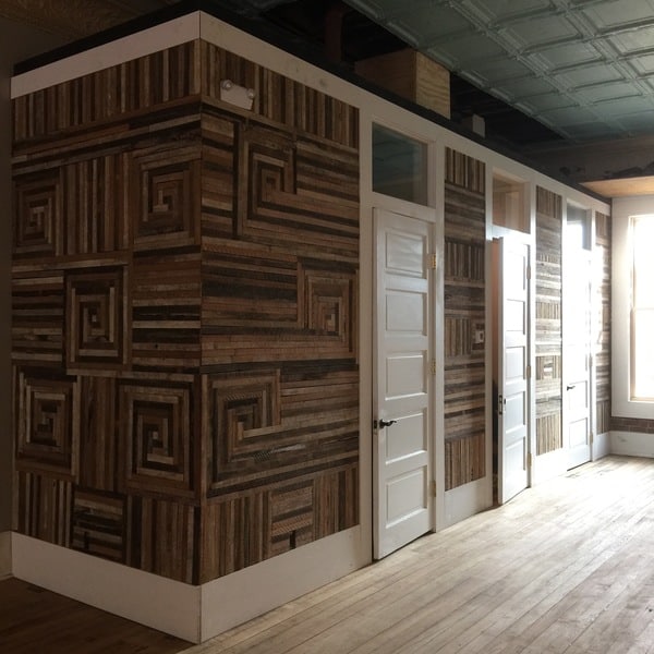 recycled lath wall in a commercial building in praise of lath art