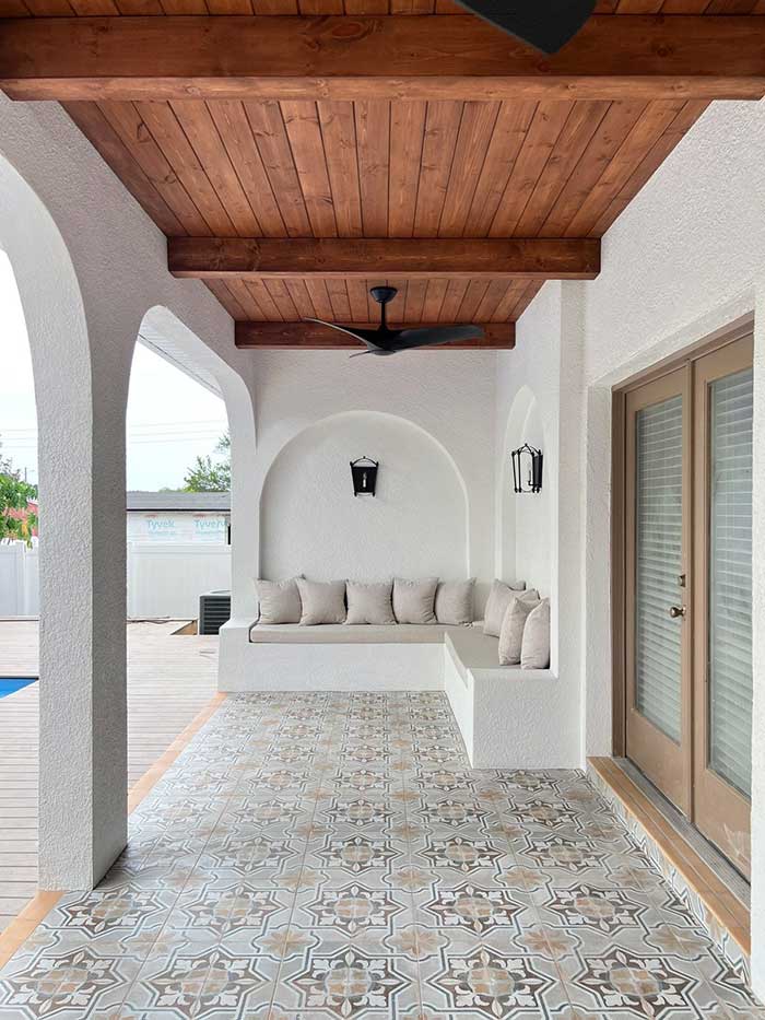 porch with diy stucco sectional and wall arches created by jenna sue design on the happy list
