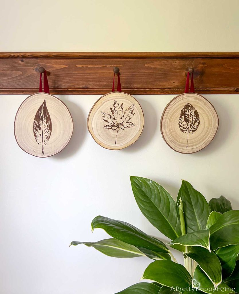 how to leaf stamp on wood using house paint or craft paint fresh leaves and wood rounds