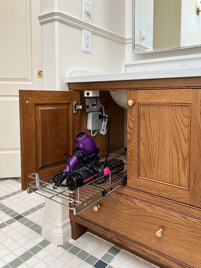 store hair tools on a pull out metal tray in a cabinet idea from erin zubot design on the happy list