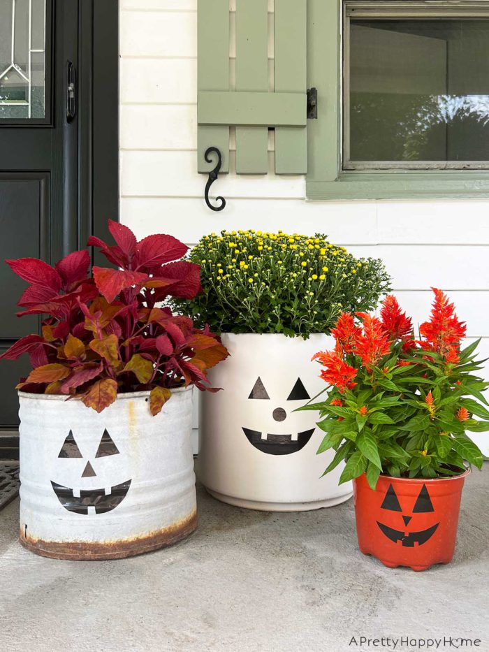 diy halloween decals with duct tape make jack o'lantern faces with black duct tape to decorate your planters