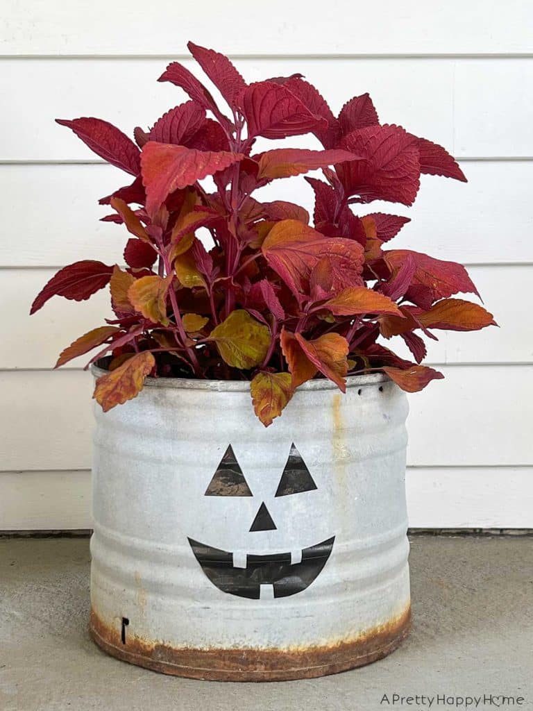 diy halloween decals with duct tape make jack o'lantern faces with black duct tape to decorate your planters