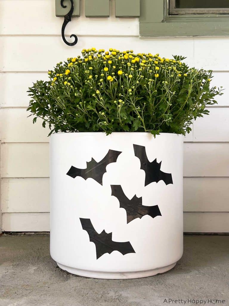 diy halloween decals with duct tape make jack o'lantern faces with black duct tape to decorate your planters