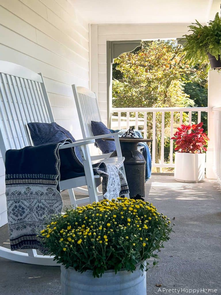 Our Fall Front Porch with two double rockers and fall mums