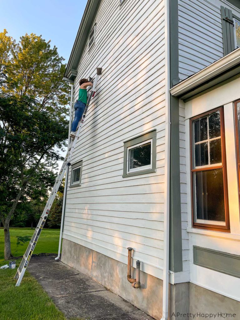 Caulk, Cracks, and Home Maintenance. Wood siding maintenance, scraping chipping paint, sanding, repainting on an old house