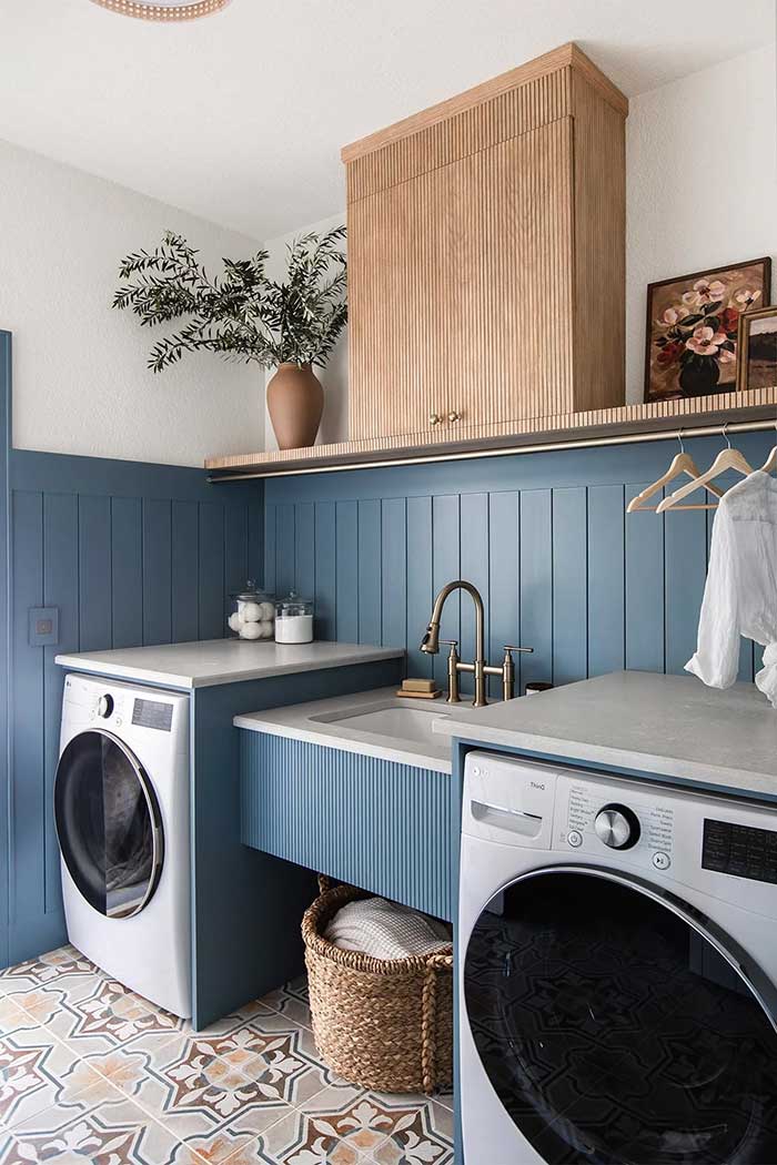 blue laundry room with pole wrap covering utility sink by jenna sue design on the happy list