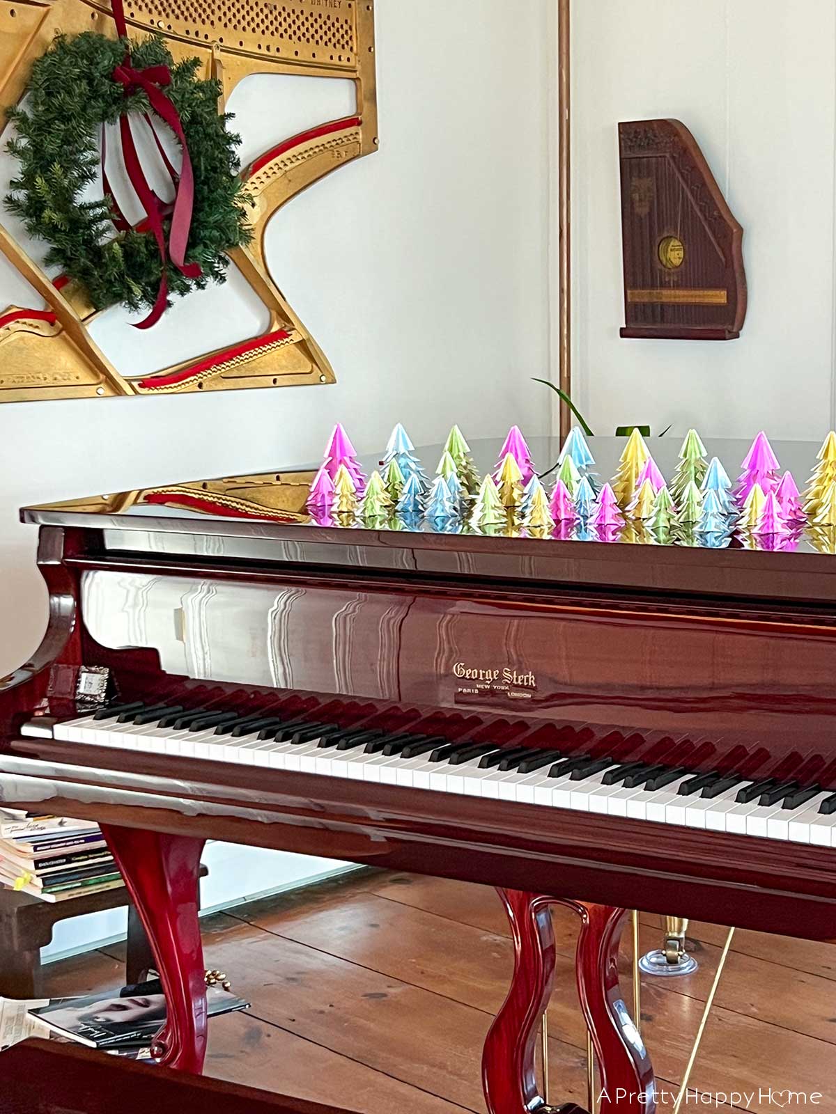 baby grand piano with origami trees christmas decor a touch of christmas in our music room piano harp art with wreath for christmas reflections this christmas 2023