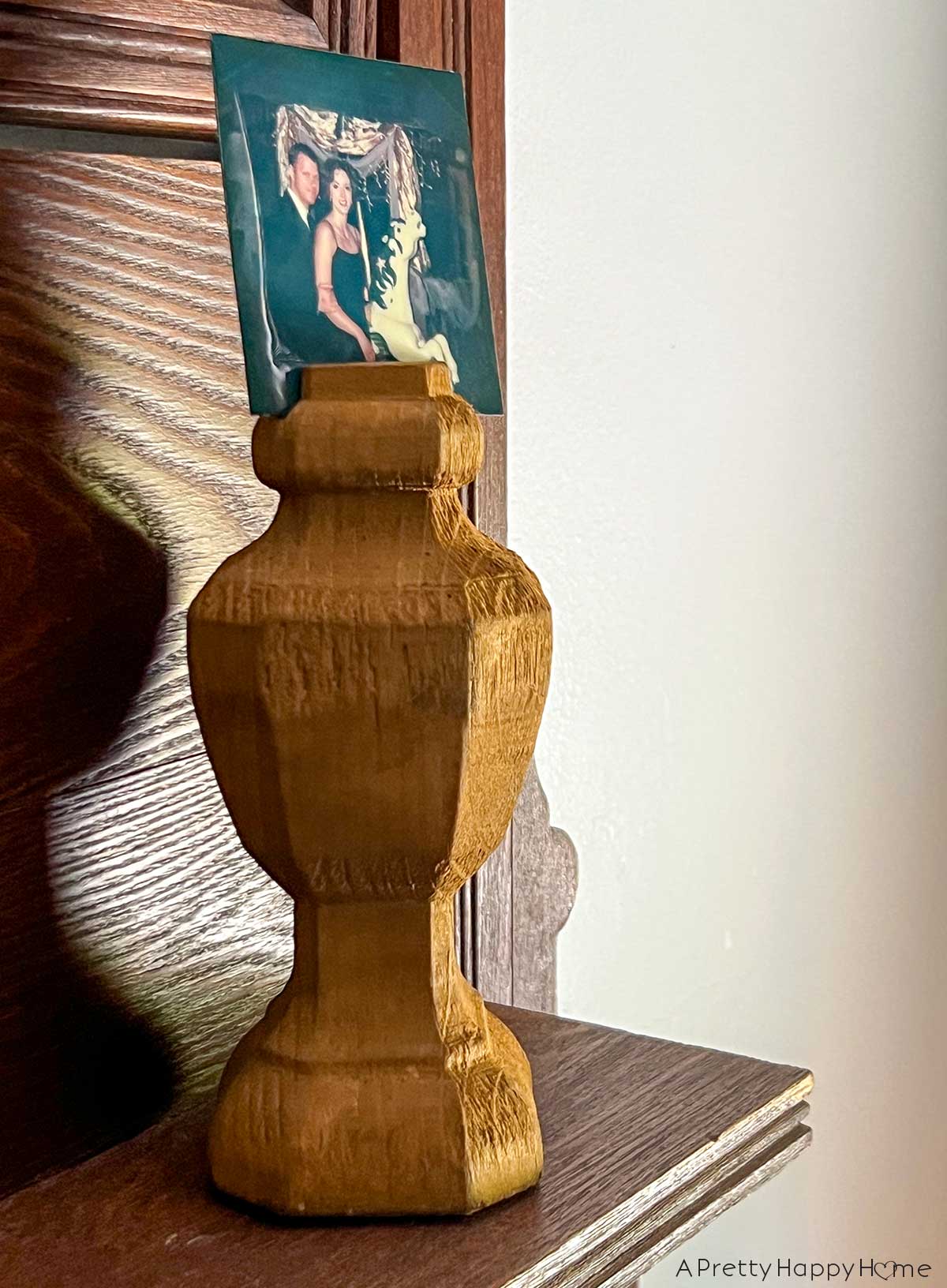 My Latest Thrift Store Finds: wood finial used as a polaroid picture holder