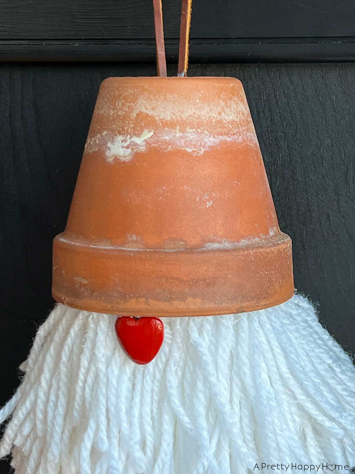 how to make a Valentine's Day Terracotta Gnome using a yarn pom pom and a terracotta pot Valentine's Day craft