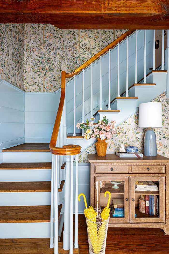 bryce dallas howard home upstate ny charming entry with blue paneling on stairs Photography by Donna Dotan Styled by Emily Pertzborn via architectural digest on the happy list
