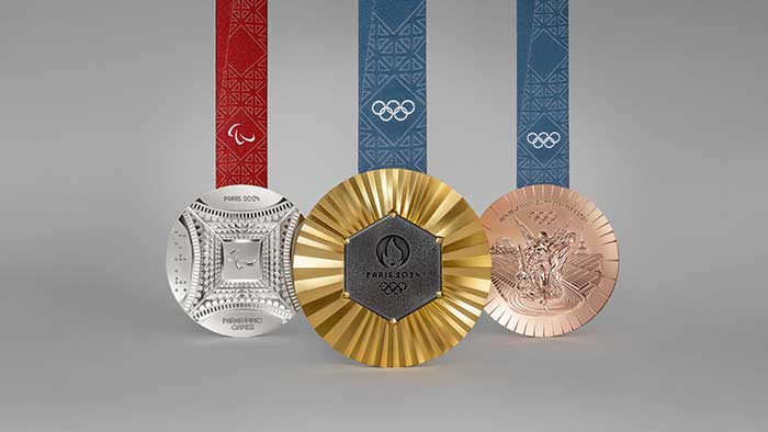 2024 olympic metals with piece of eiffel tower on the happy list