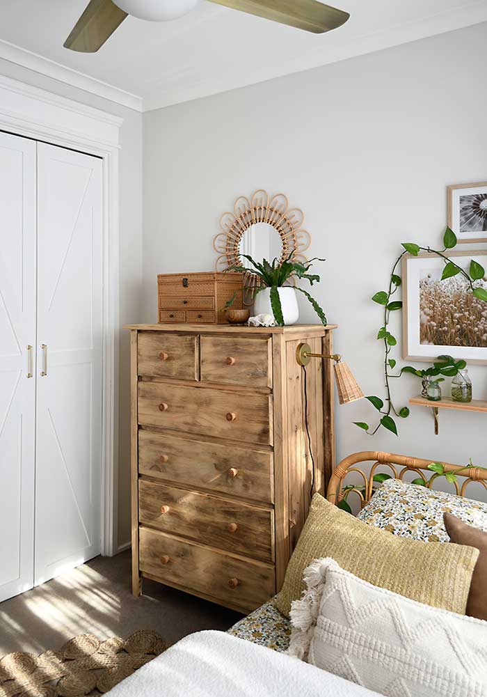 teen boho bedroom with lamp attached to side of dresser by the painted hive on the happy list