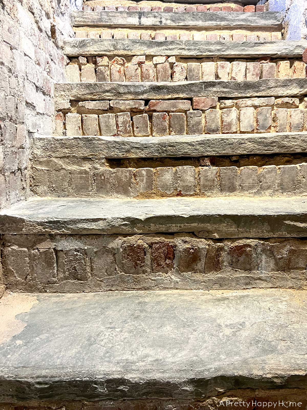 wear on our stone steps stone steps showing wear in basement in home