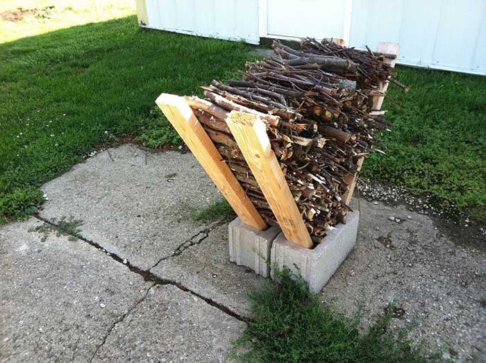 cinder block and 2x4 kindling storage from the Homedit on the happy list