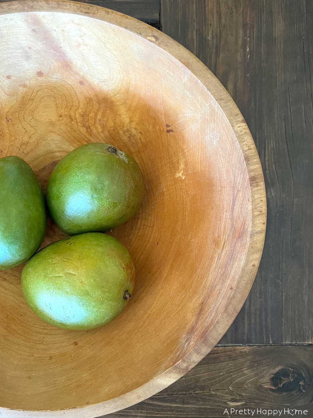 wood bowl filled with mangos Wood Bowls: For Food or Decor?