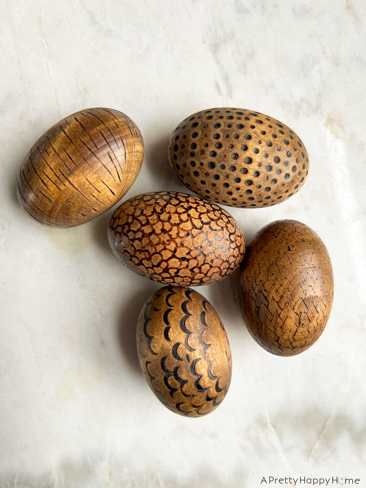7 Ways To Decorate Wood Easter Eggs decorate wood eggs with a wood burning tool