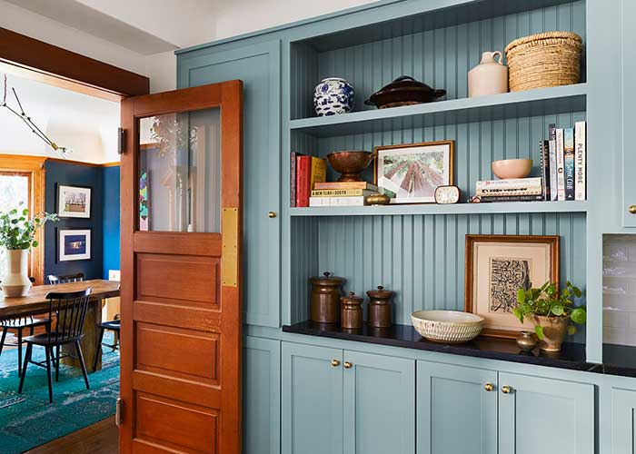 jamie haller interiors craftsman los angeles blue cabinets with swinging wood door with brass push plate on the happy list