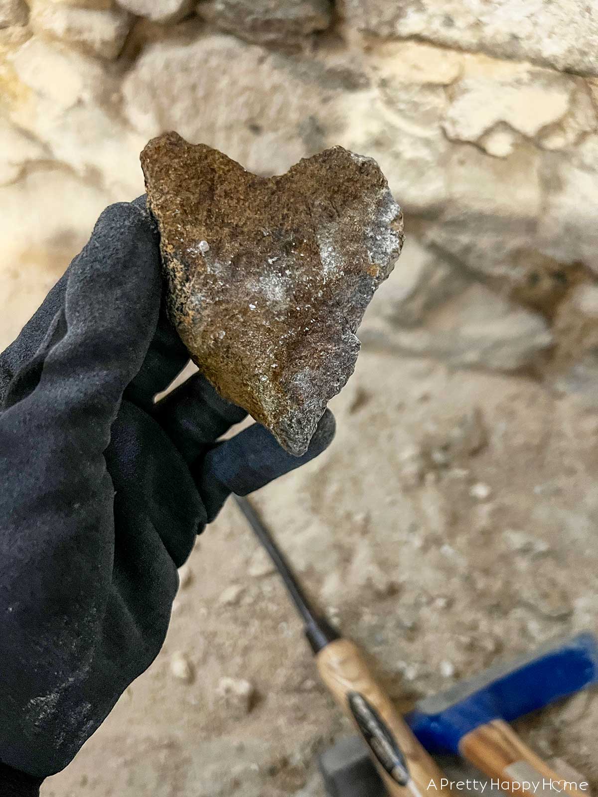 6 Things We Found Inside Our Stone Walls stone foundation being repointed inside a basement heart shaped rock