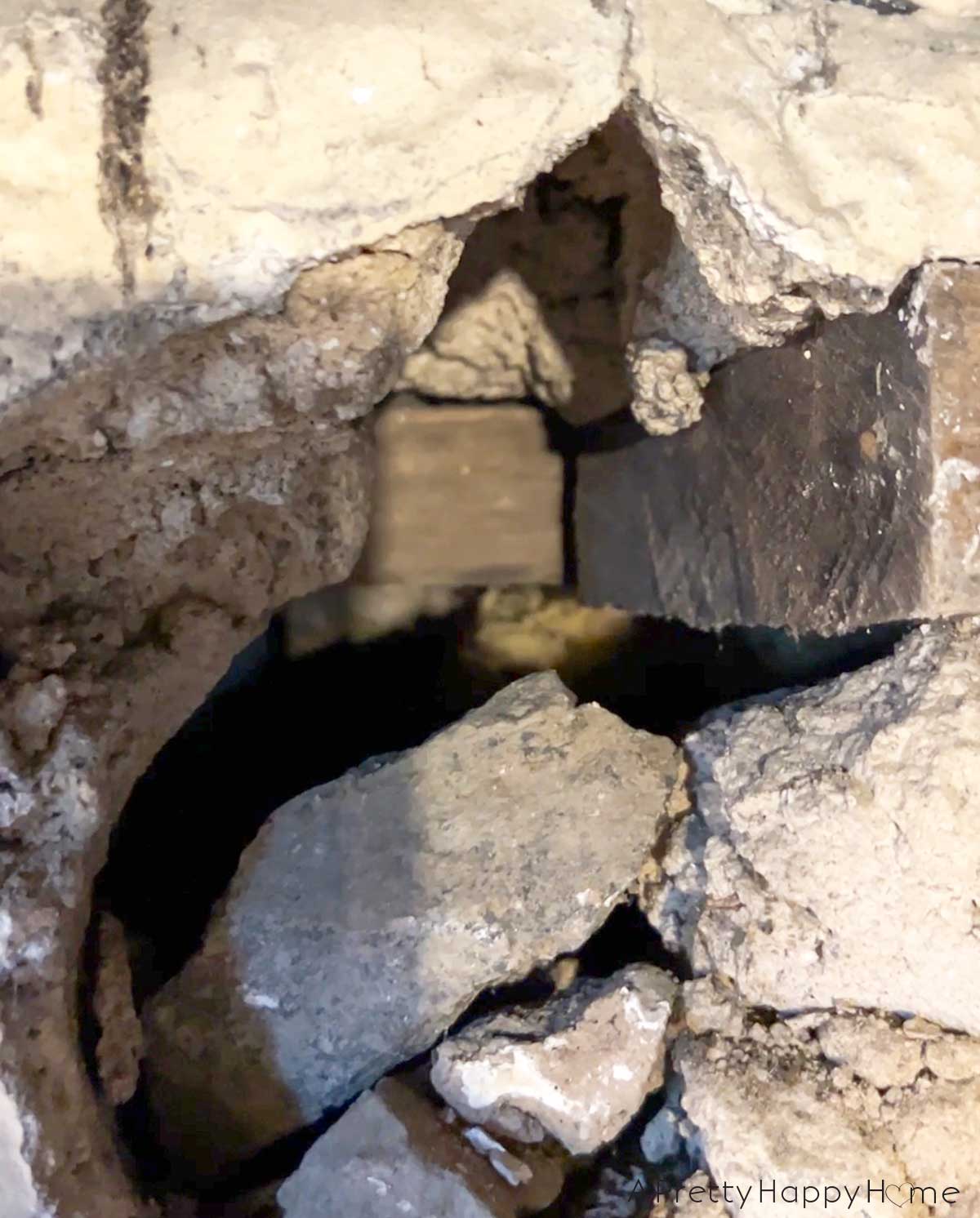 6 Things We Found Inside Our Stone Walls stone foundation being repointed inside a basement hollow areas