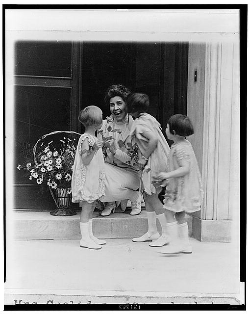 Mrs. Coolidge gets a basket of flowers and a kiss 1927 via Library of congress may day basket tradition