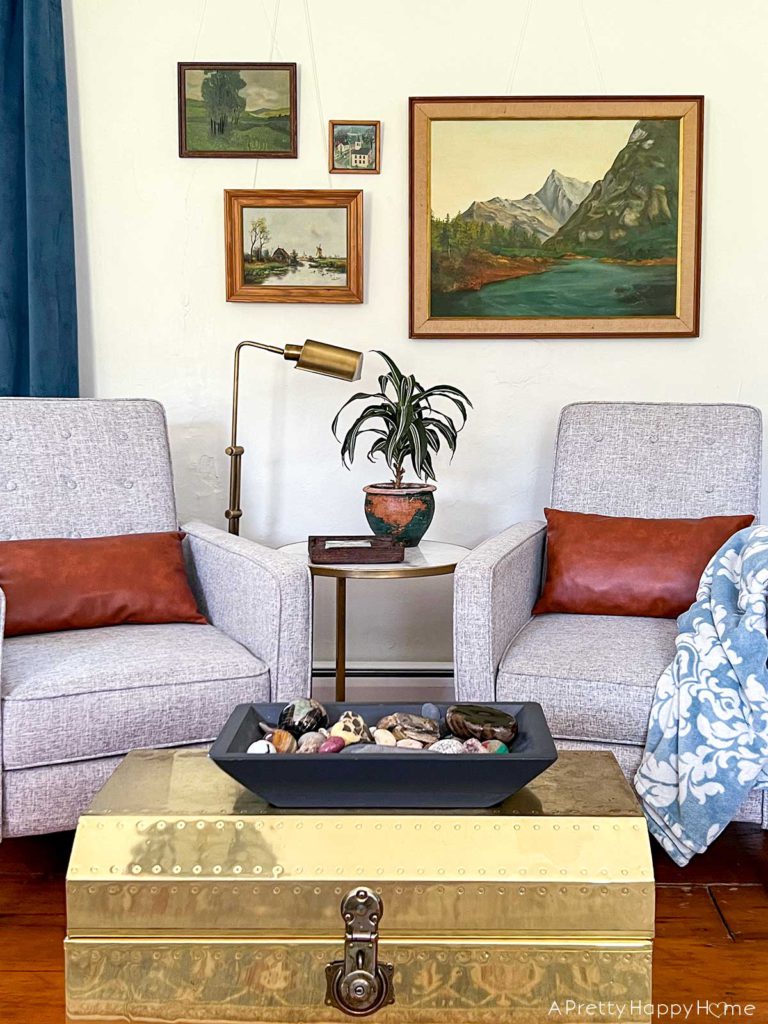 How I Styled My Latest Thrift Store Finds nature painting gallery wall above a seating area