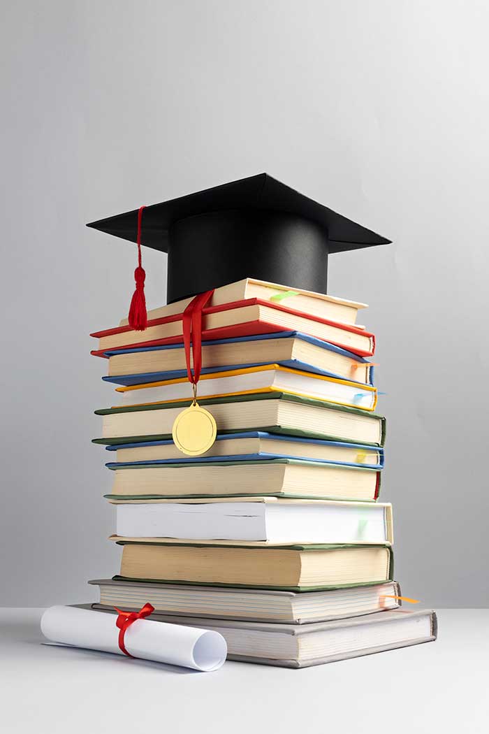 front view stacked books graduation cap diploma education day image by freepik