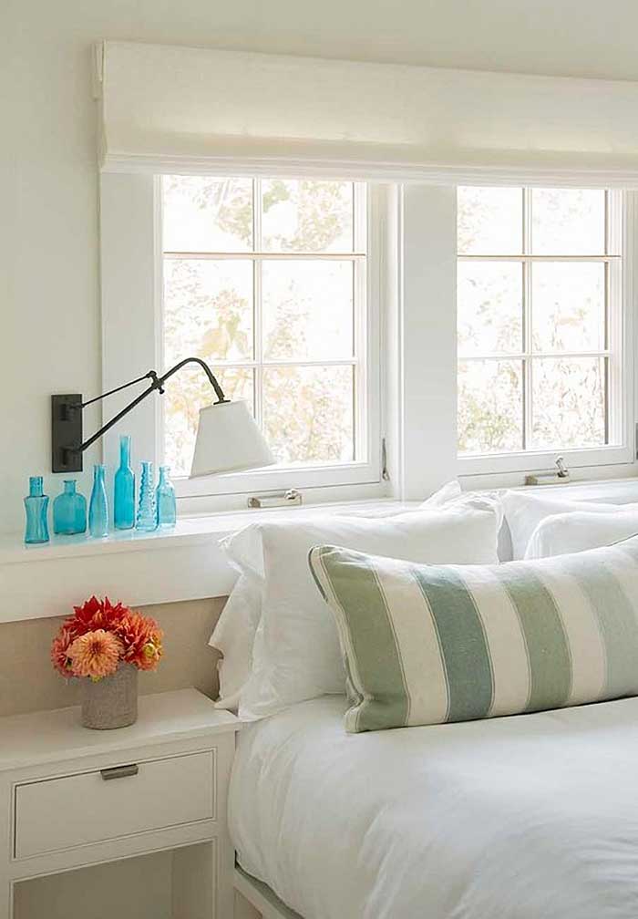 marthas vineyard bedroom with collection of blue glass bottles from marthas vineyard interior design via town and country living on the happy list