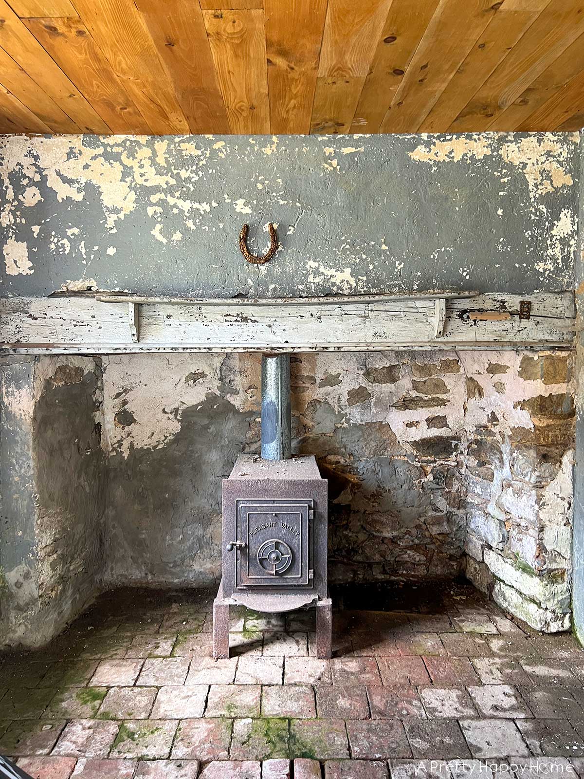 stone carriage house restoration stone fireplace with wood mantel in 18th century carriage house