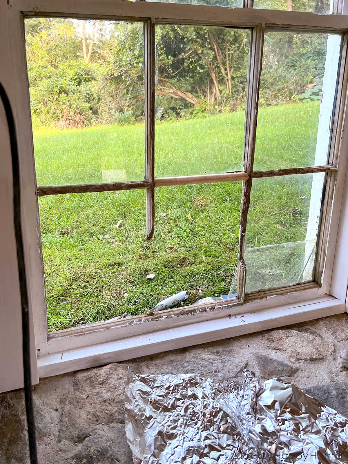 stone carriage house restoration rebuilding rotten wood muntins on old wood windows 18th century carriage house